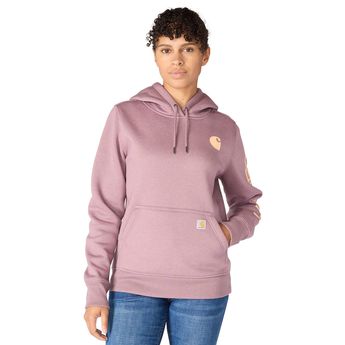 Person wearing a pink hoodie with a brand logo on a white background