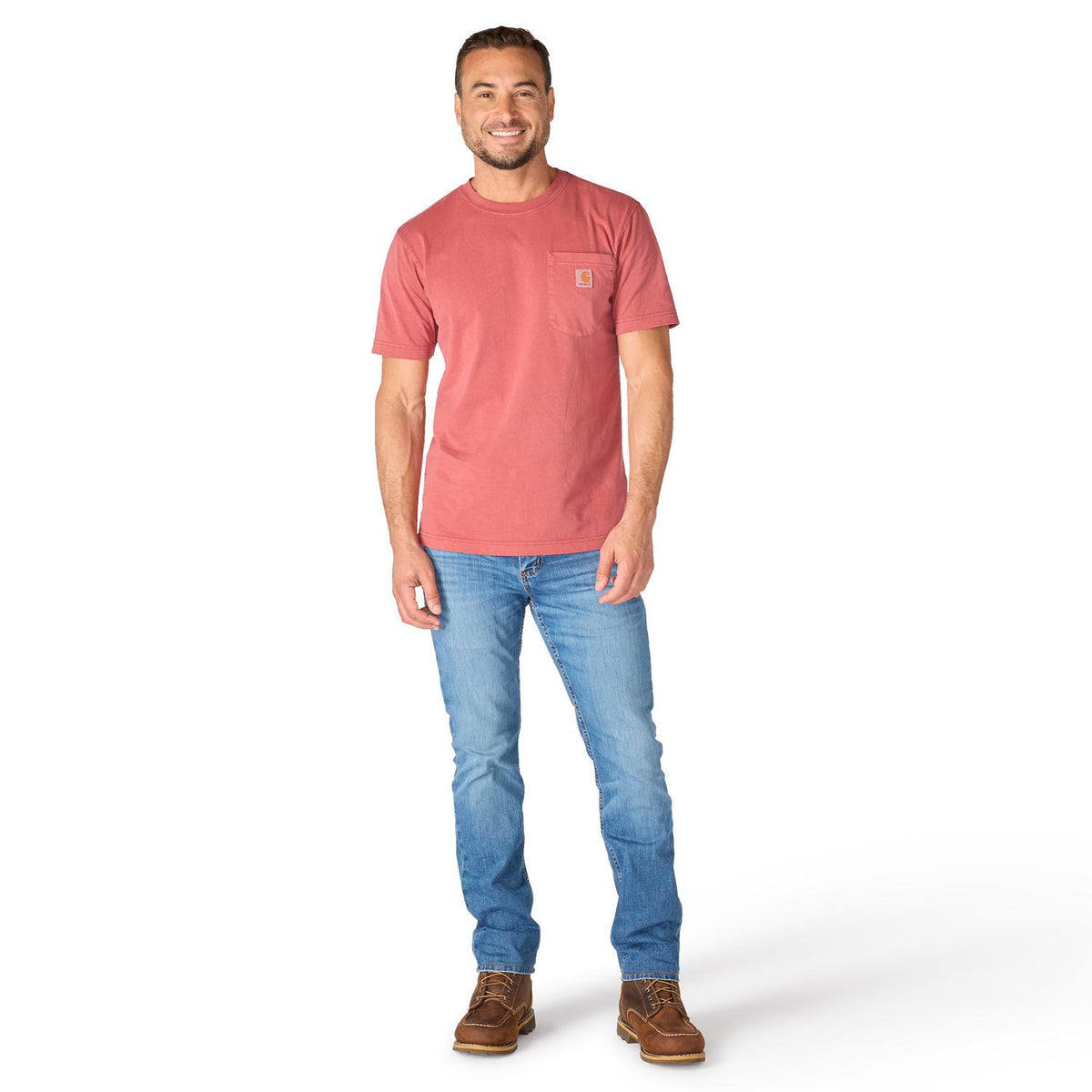 Man wearing a red t-shirt and blue jeans on a white background