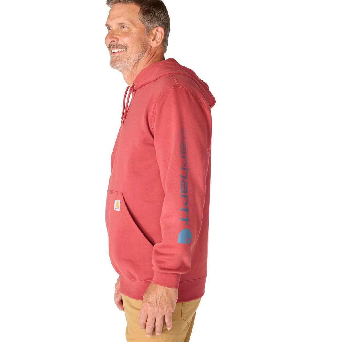 Man wearing a red hoodie with a visible brand logo on a white background
