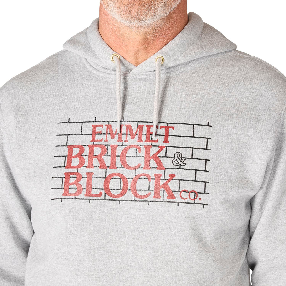 Gray hoodie with 'Emmett Brick & Block co.' text and design on a white background