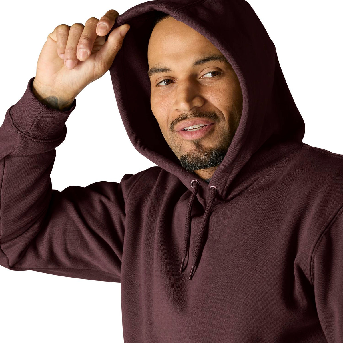 Man wearing a maroon hoodie against a white background