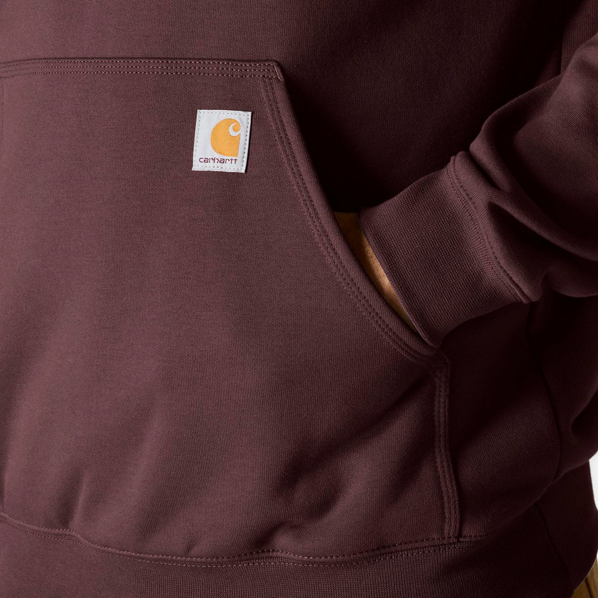 Red hoodie with Carhartt logo on the chest pocket