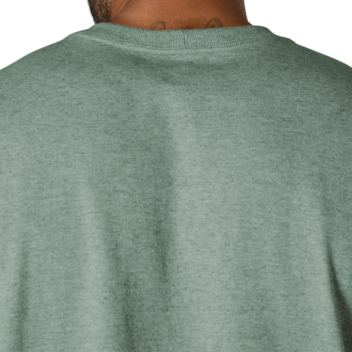 Green sweatshirt worn by a person on a white background