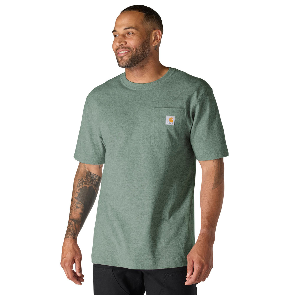 Man wearing a green t-shirt with a visible brand logo on a white background